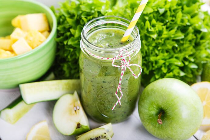 Hearty detox lunch smoothie with bananas, apples, spinach, nuts and flax seeds