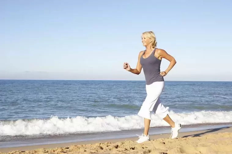 An elderly woman running for weight loss and good heart function